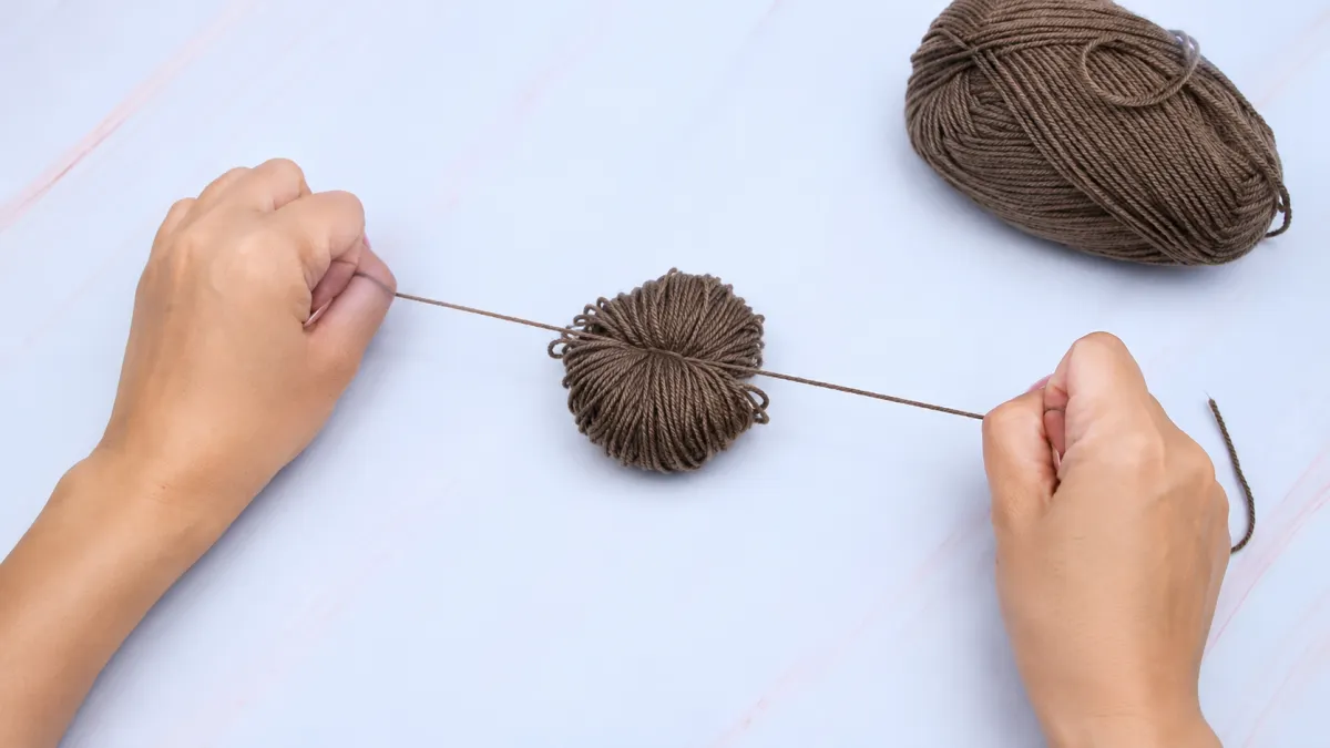 Step 5: Tighten the Center Knot to Secure the Yarn Bundle