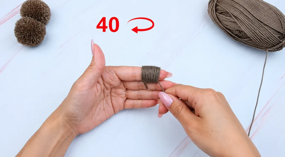 Step 12: Wrap Yarn Around Your Finger for the Teddy Bear's Arms