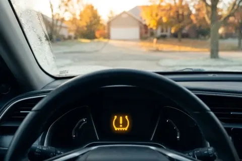 Why Dashboard Tire Pressure Lights Flash Every Autumn (and the Door Sticker Mistake)